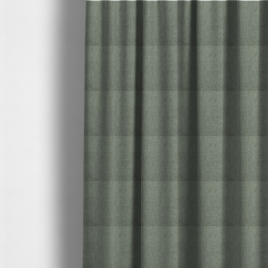 The fabric used to create these made-to-measure curtains is a sage green upholstery fabric with a dense, diagonal textured weave.
