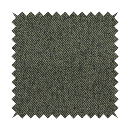 A dark forest green upholstery fabric with a dense, diagonal textured weave.