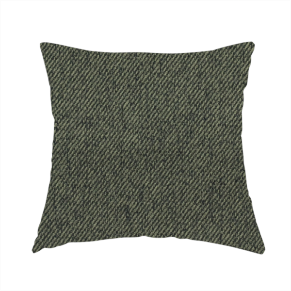 The fabric used to create this handmade cushion is a dark forest green upholstery fabric with a dense, diagonal textured weave.