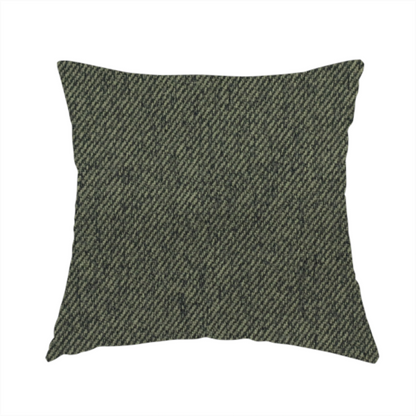 The fabric used to create this handmade cushion is a dark forest green upholstery fabric with a dense, diagonal textured weave.