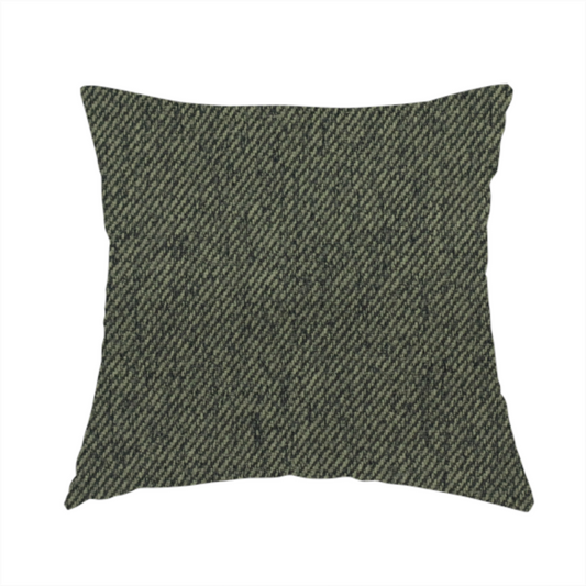 The fabric used to create this handmade cushion is a dark forest green upholstery fabric with a dense, diagonal textured weave.