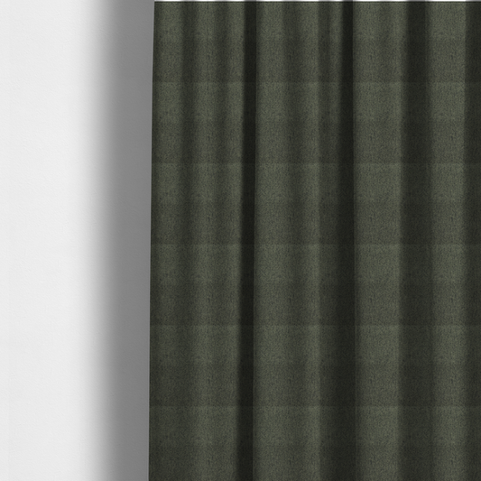 The fabric used to create these made-to-measure curtains is a dark forest green upholstery fabric with a dense, diagonal textured weave.