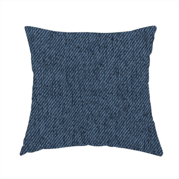 The fabric used to create this handmade cushion is a navy blue upholstery fabric with a dense, diagonal textured weave.
