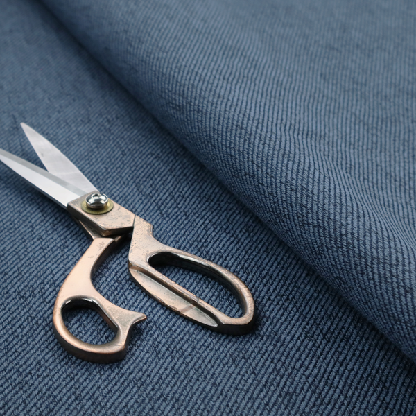 A navy blue upholstery fabric with a dense, diagonal textured weave.
