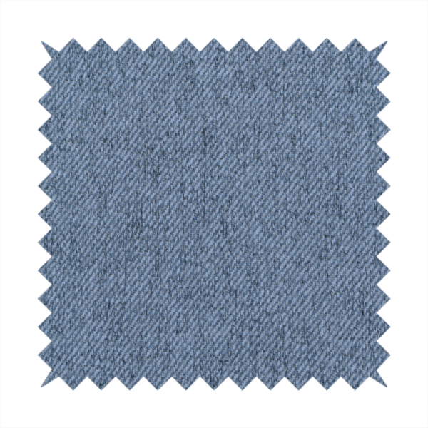 A mid-blue upholstery fabric with a dense, diagonal textured weave.