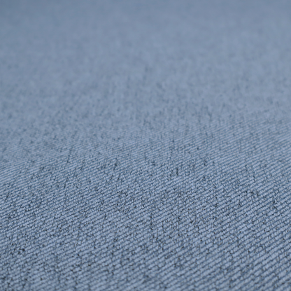 A mid-blue upholstery fabric with a dense, diagonal textured weave.