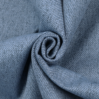 A mid-blue upholstery fabric with a dense, diagonal textured weave.