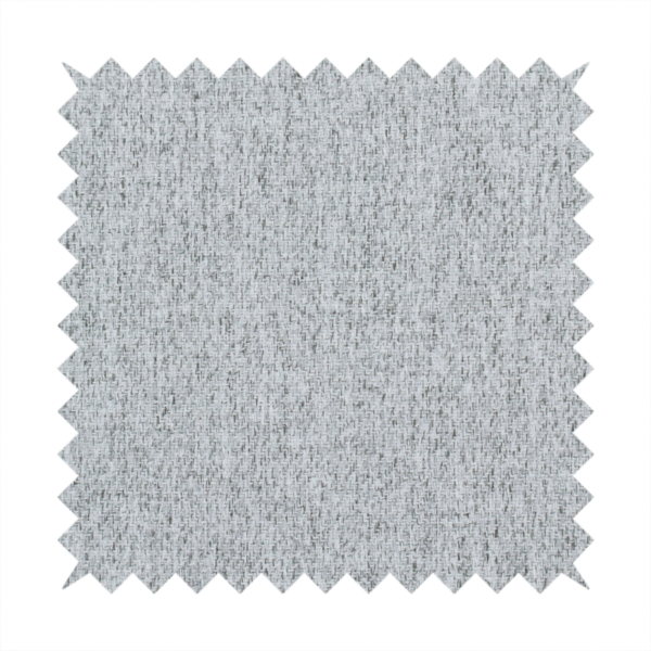 A light grey upholstery fabric with a dense, speckled textured weave.