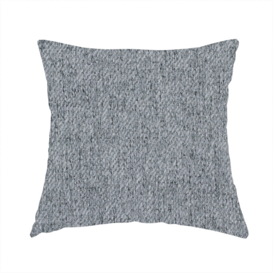 The fabric used to create this handmade cushion is a mid-grey upholstery fabric with a dense, diagonal marled weave.