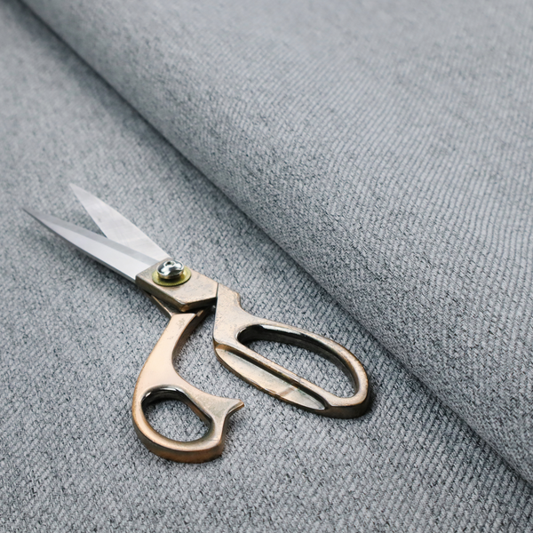 A mid-grey upholstery fabric with a dense, diagonal marled weave.