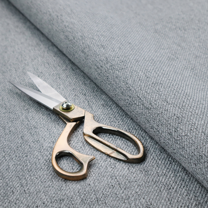 A mid-grey upholstery fabric with a dense, diagonal marled weave.