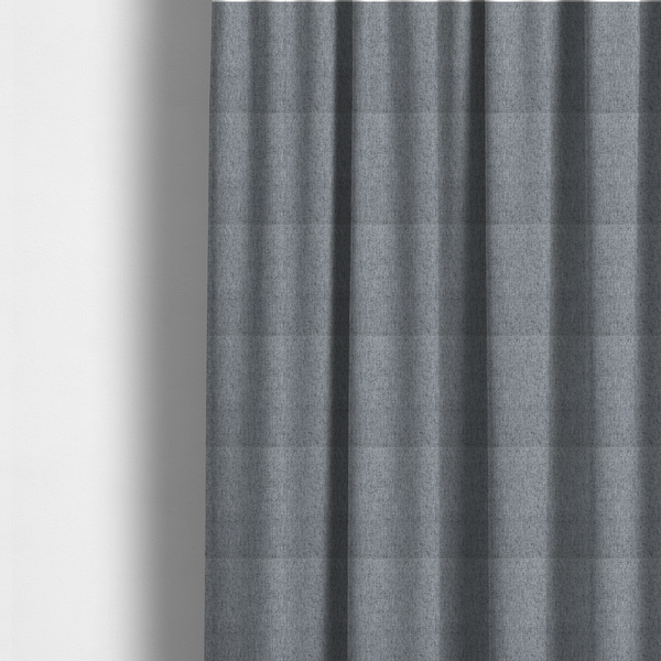 The fabric used to create these made-to-measure curtains is a mid-grey upholstery fabric with a dense, diagonal marled weave.
