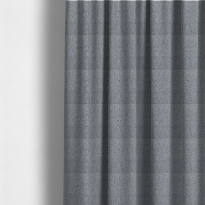 The fabric used to create these made-to-measure curtains is a mid-grey upholstery fabric with a dense, diagonal marled weave.
