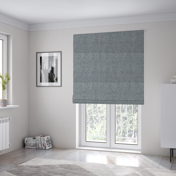The fabric used to create these Roman blinds is a mid-grey upholstery fabric with a dense, diagonal marled weave.