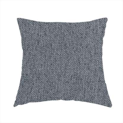 The fabric used to create this handmade cushion is a charcoal grey upholstery fabric with a dense, diagonal textured weave.
