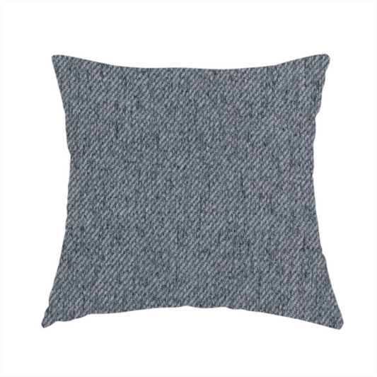 The fabric used to create this handmade cushion is a charcoal grey upholstery fabric with a dense, diagonal textured weave.