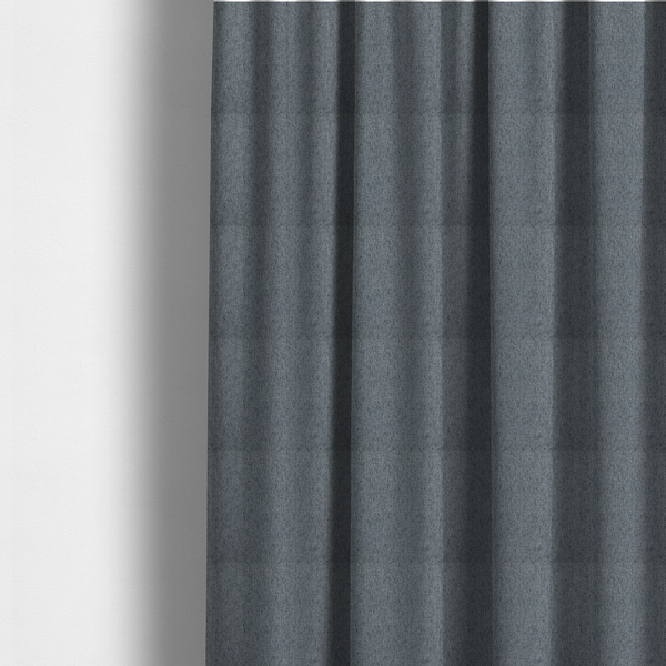 The fabric used to create these Roman blinds is a charcoal grey upholstery fabric with a dense, diagonal textured weave.