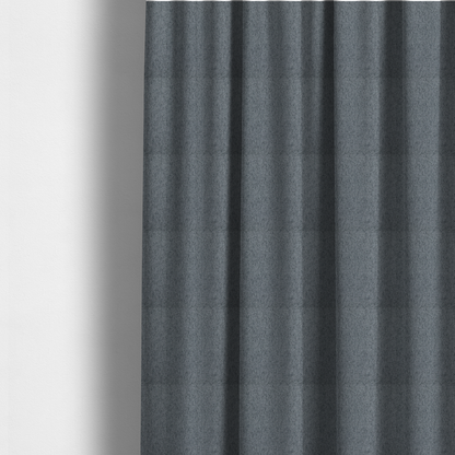 The fabric used to create these Roman blinds is a charcoal grey upholstery fabric with a dense, diagonal textured weave.