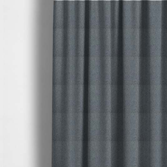 The fabric used to create these Roman blinds is a charcoal grey upholstery fabric with a dense, diagonal textured weave.