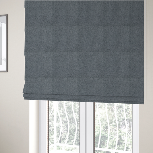 The fabric used to create these Roman blinds is a charcoal grey upholstery fabric with a dense, diagonal textured weave.