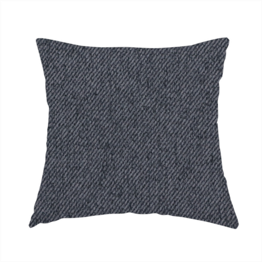 The fabric used to create this handmade cushion is a charcoal grey upholstery fabric with a dense, diagonal twill weave.