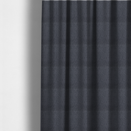 The fabric used to create these made-to-measure curtains is a charcoal grey upholstery fabric with a dense, diagonal twill weave.