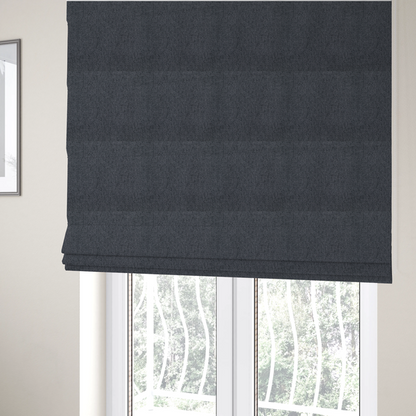 The fabric used to create these Roman blinds is a charcoal grey upholstery fabric with a dense, diagonal twill weave.