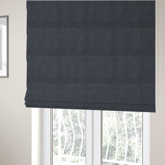 The fabric used to create these Roman blinds is a charcoal grey upholstery fabric with a dense, diagonal twill weave.