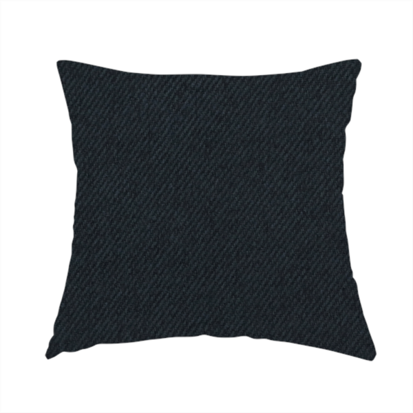 The fabric used to create this handmade cushion is a midnight black upholstery fabric with a dense, diagonal twill weave.