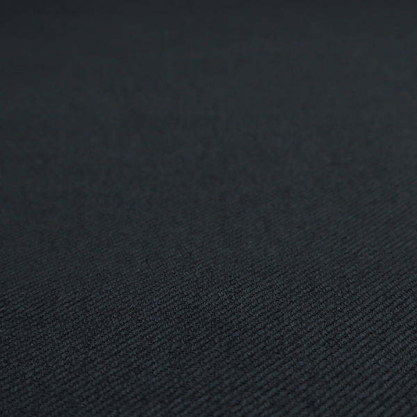A midnight black upholstery fabric with a dense, diagonal twill weave.