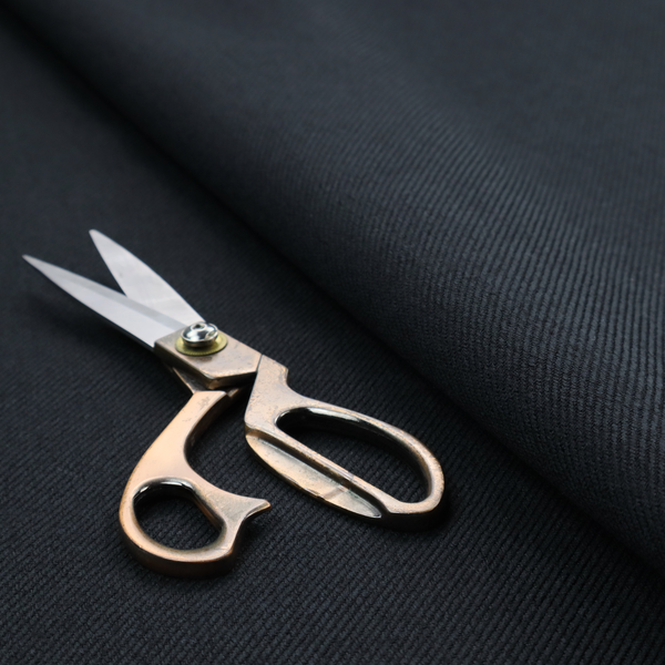 A midnight black upholstery fabric with a dense, diagonal twill weave.