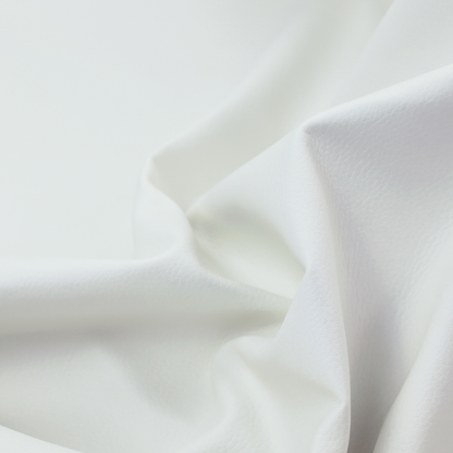 A bright white faux leather fabric featuring a subtle, pebbled texture.