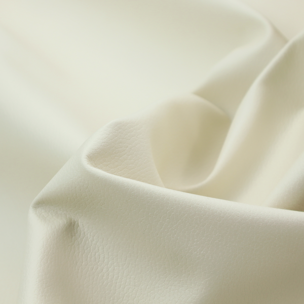 Boston Faux Leather Upholstery Fabric in a warm cream colour, featuring a classic pebbled grain texture.