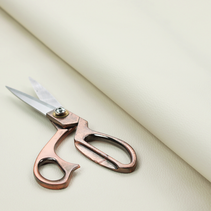Boston Faux Leather Upholstery Fabric in a warm cream colour, featuring a classic pebbled grain texture.