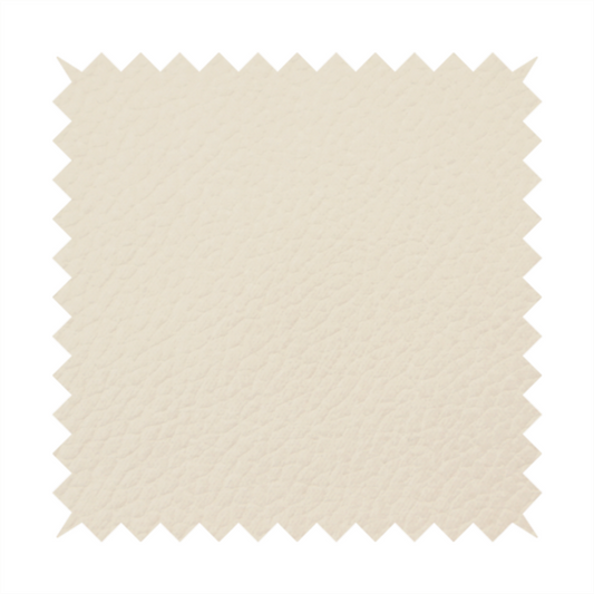 Boston Faux Leather Upholstery Fabric in a soft beige colour, showcasing a fine pebbled texture.
