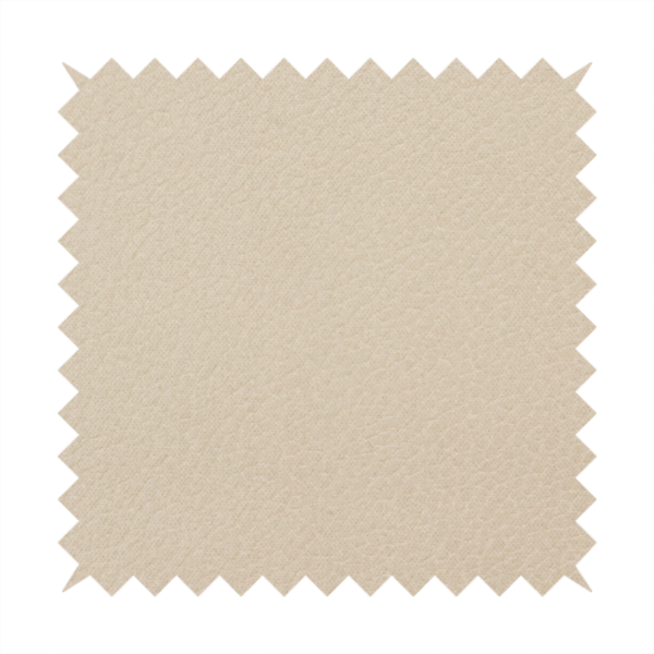 Boston Faux Leather Upholstery Fabric in a warm beige tone, showcasing a fine, textured leather grain.
