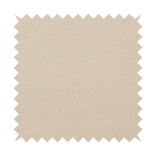 Boston Faux Leather Upholstery Fabric in a warm beige tone, showcasing a fine, textured leather grain.