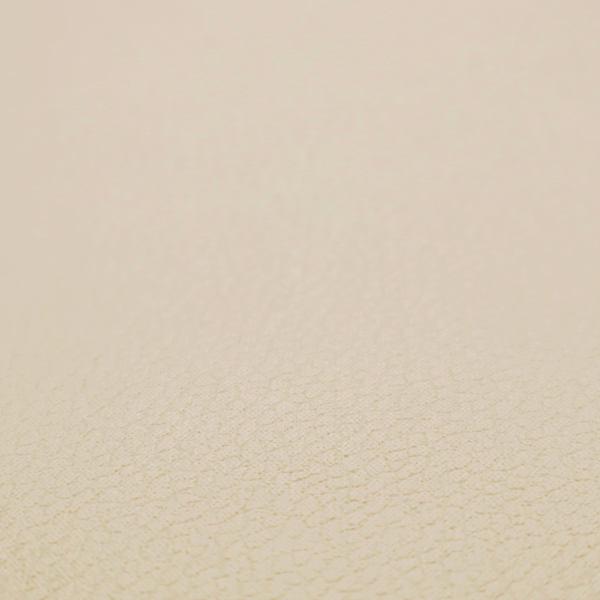 Boston Faux Leather Upholstery Fabric in a warm beige tone, showcasing a fine, textured leather grain.