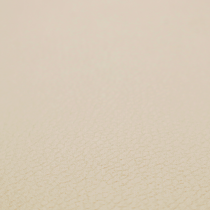 Boston Faux Leather Upholstery Fabric in a warm beige tone, showcasing a fine, textured leather grain.
