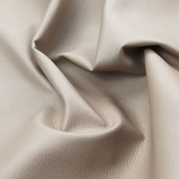 Boston Faux Leather Upholstery Fabric in a taupe-beige colour, showing a prominent pebbled grain texture.