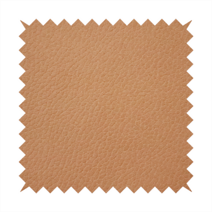 Boston Faux Leather Upholstery Fabric in a warm tan colour, showcasing a fine pebbled grain texture.