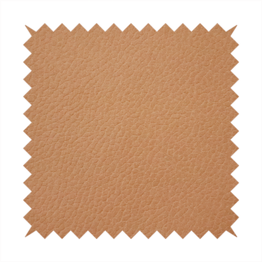 Boston Faux Leather Upholstery Fabric in a warm tan colour, showcasing a fine pebbled grain texture.