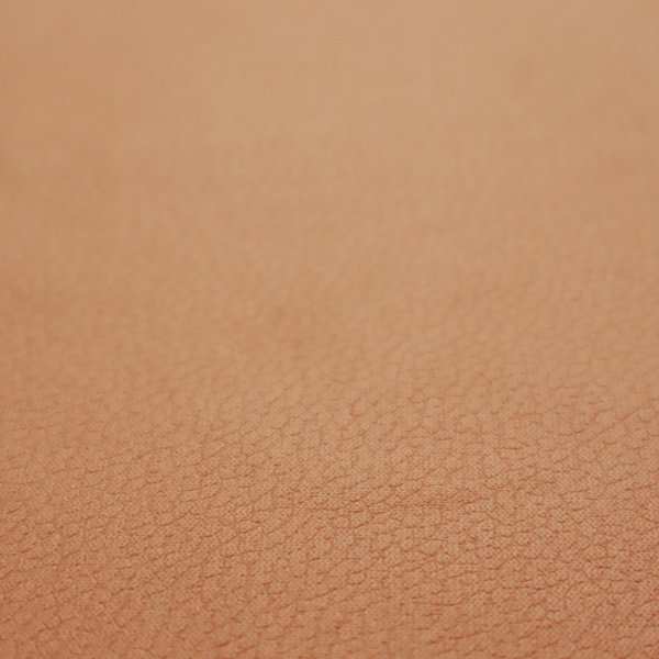 Boston Faux Leather Upholstery Fabric in a warm tan colour, showcasing a fine pebbled grain texture.