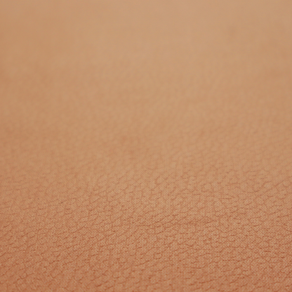Boston Faux Leather Upholstery Fabric in a warm tan colour, showcasing a fine pebbled grain texture.