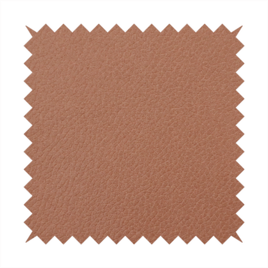 Boston Faux Leather Upholstery Fabric in a rich tan colour, showcasing a fine, textured leather grain.