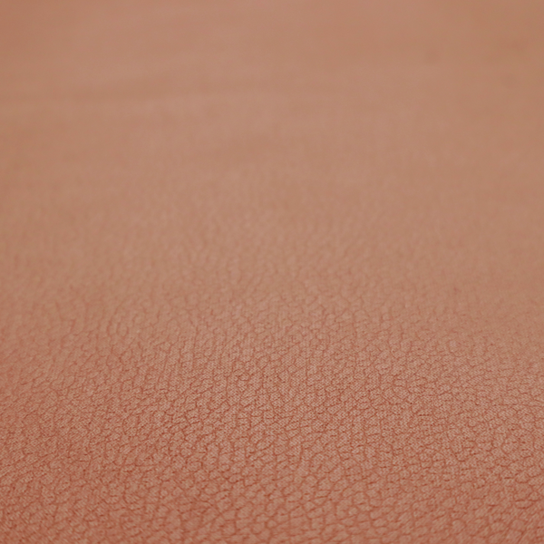 Boston Faux Leather Upholstery Fabric in a rich tan colour, showcasing a fine, textured leather grain.