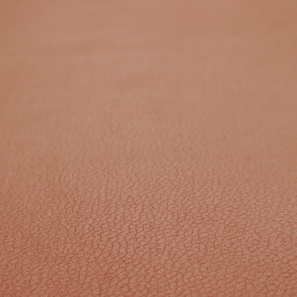 Boston Faux Leather Upholstery Fabric in a rich tan colour, showcasing a fine, textured leather grain.