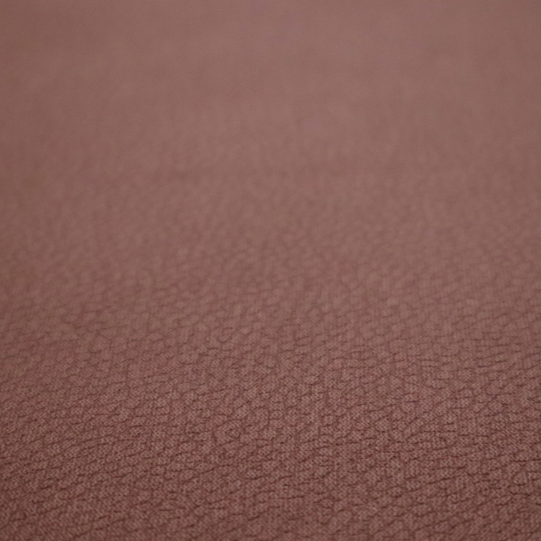 Boston Faux Leather Upholstery Fabric in a deep reddish-brown colour, showcasing a fine pebbled grain texture.