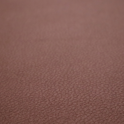 Boston Faux Leather Upholstery Fabric in a deep reddish-brown colour, showcasing a fine pebbled grain texture.
