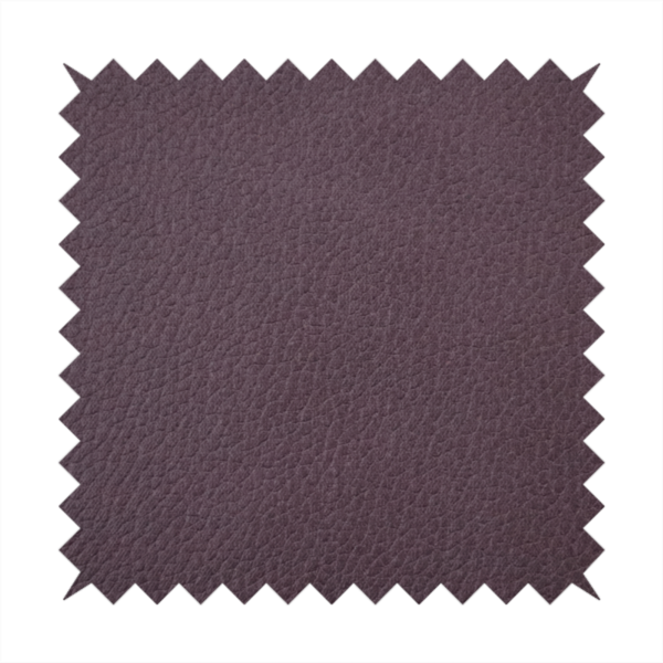 Boston Faux Leather Upholstery Fabric in a deep aubergine purple colour, showcasing a fine pebbled grain texture.
